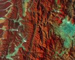 This image captured by the Copernicus Sentinel-2A satellite on 28 December 2015. It demonstrates Nepal’s varied terrain from the mountains to the north (left side) to the plains in the south (right side). Vegetation appears red in this false-colour image, while waterways and buildings appear light green and blue. Image: ESA.